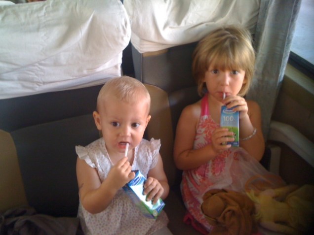 On a real train. Drinking milk.  Butter wouldn't melt...