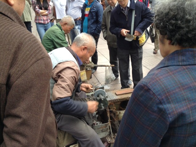 Local ironmongers hard at it in downtown Shanghai